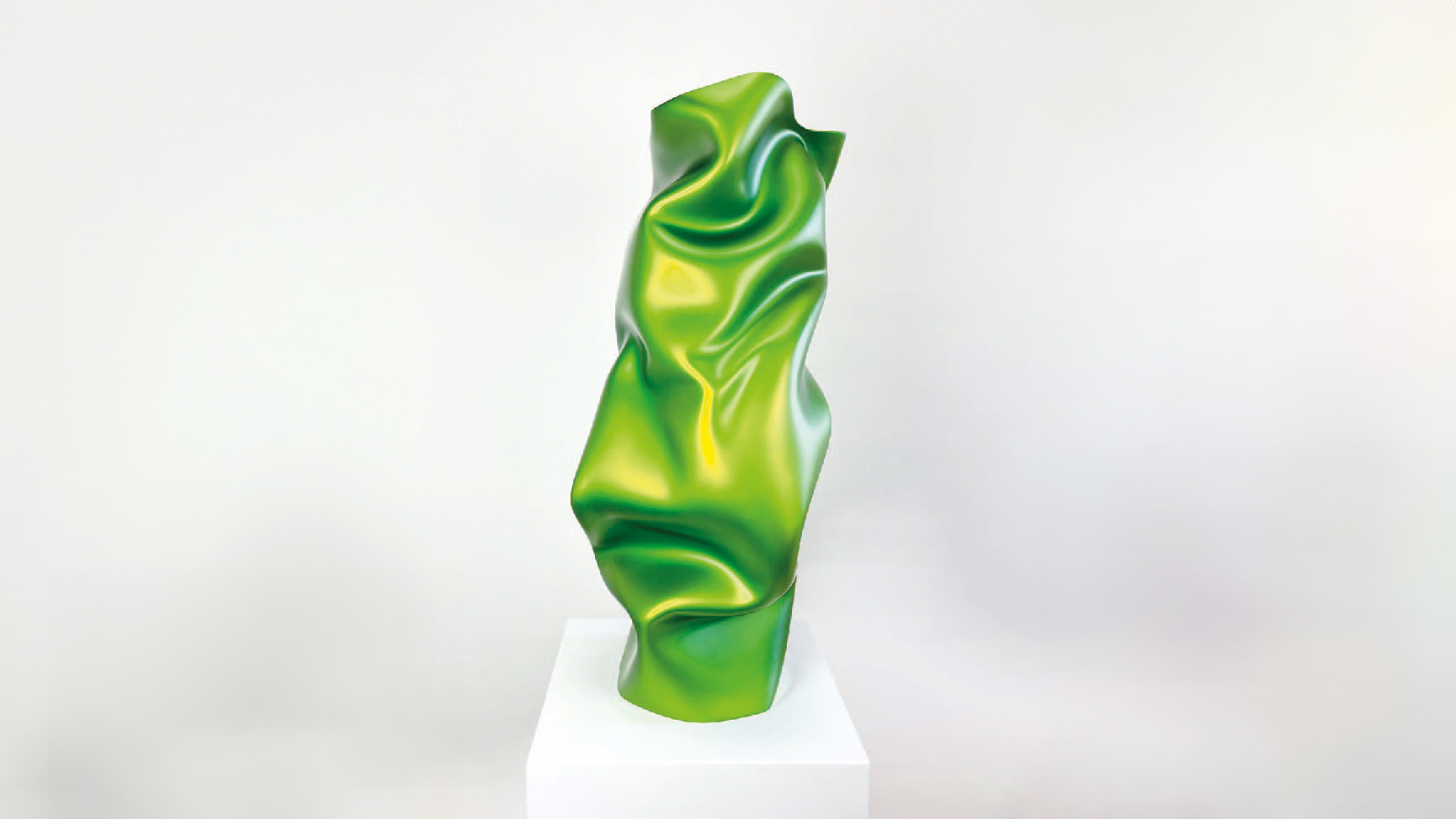 Gr&uuml;ne moderne Skulptur auf Podest